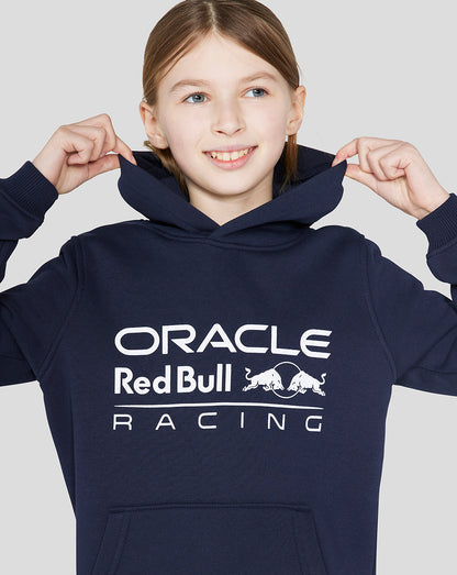 Front view of a junior navy Oracle Red Bull Racing Core Overhead Hoodie with a large logo on the chest