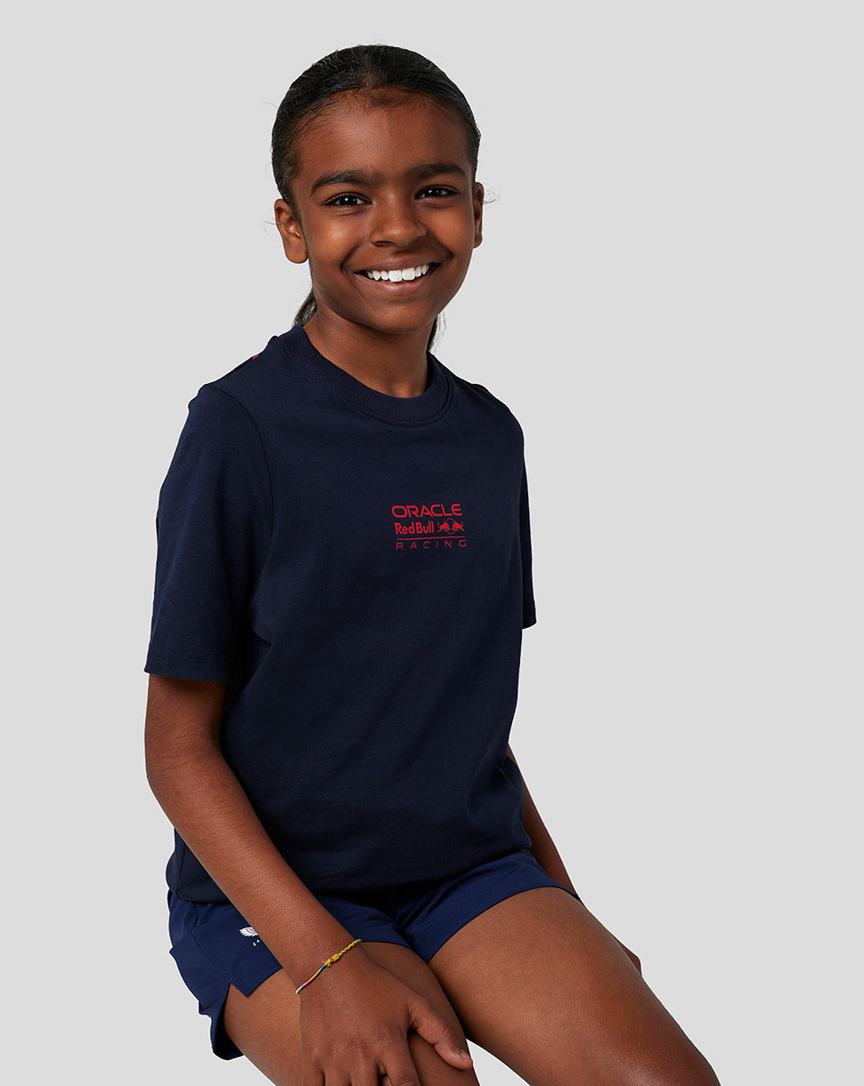 Smiling child in navy Oracle Red Bull Racing T shirt with front logo and back bull graphic