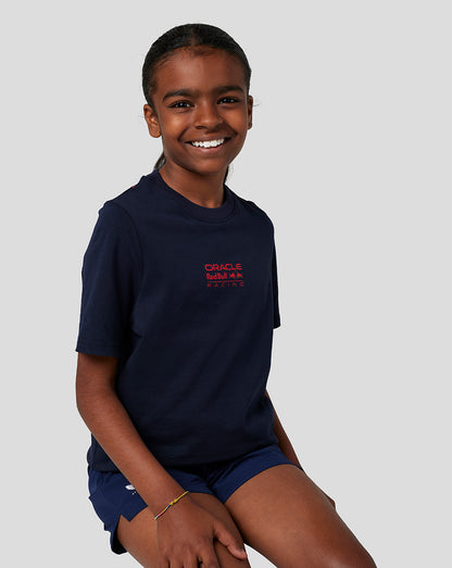 Smiling child in navy Oracle Red Bull Racing T shirt with front logo and back bull graphic