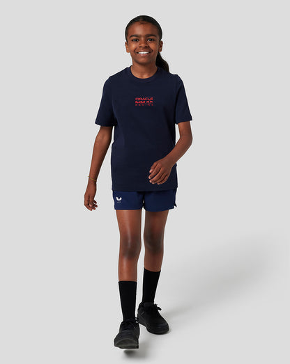 Child wearing navy Oracle Red Bull Racing T Shirt with red logo on the chest