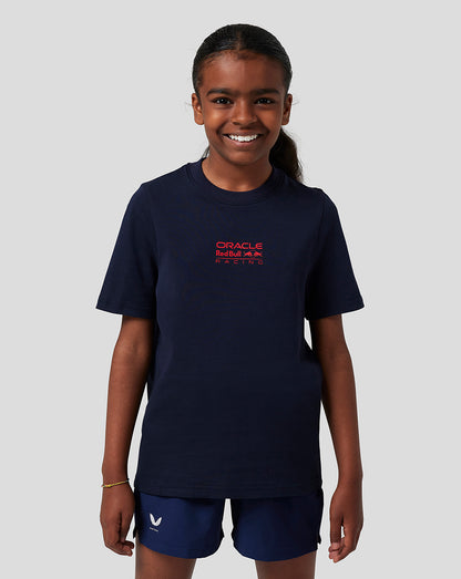 Child wearing navy Oracle Red Bull Racing T shirt with red front logo and back bull graphic