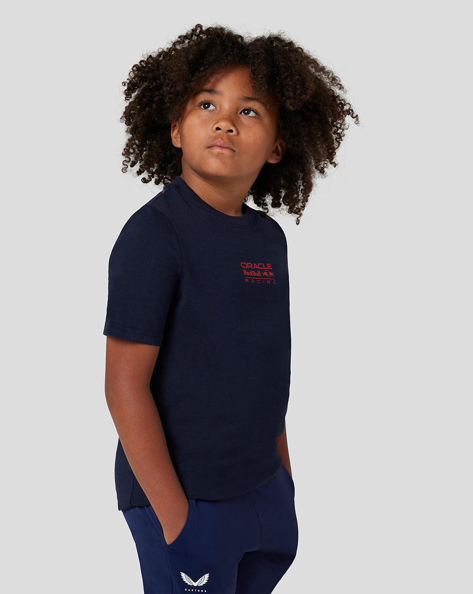 Profile view of a child in a navy Night Sky Red Bull Racing T-shirt with the red front logo