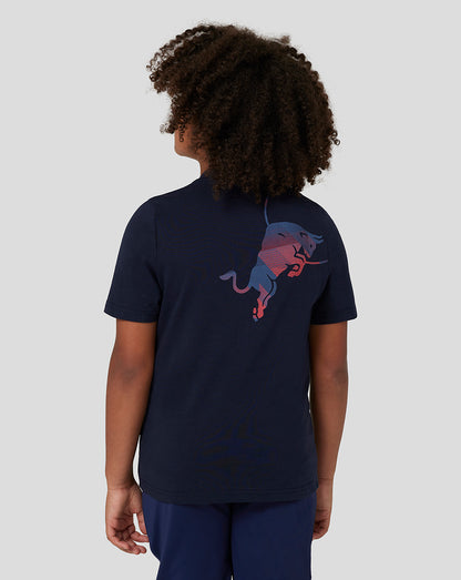 Back view of a child in a navy Red Bull Racing T shirt with a large colorful bull graphic across the back