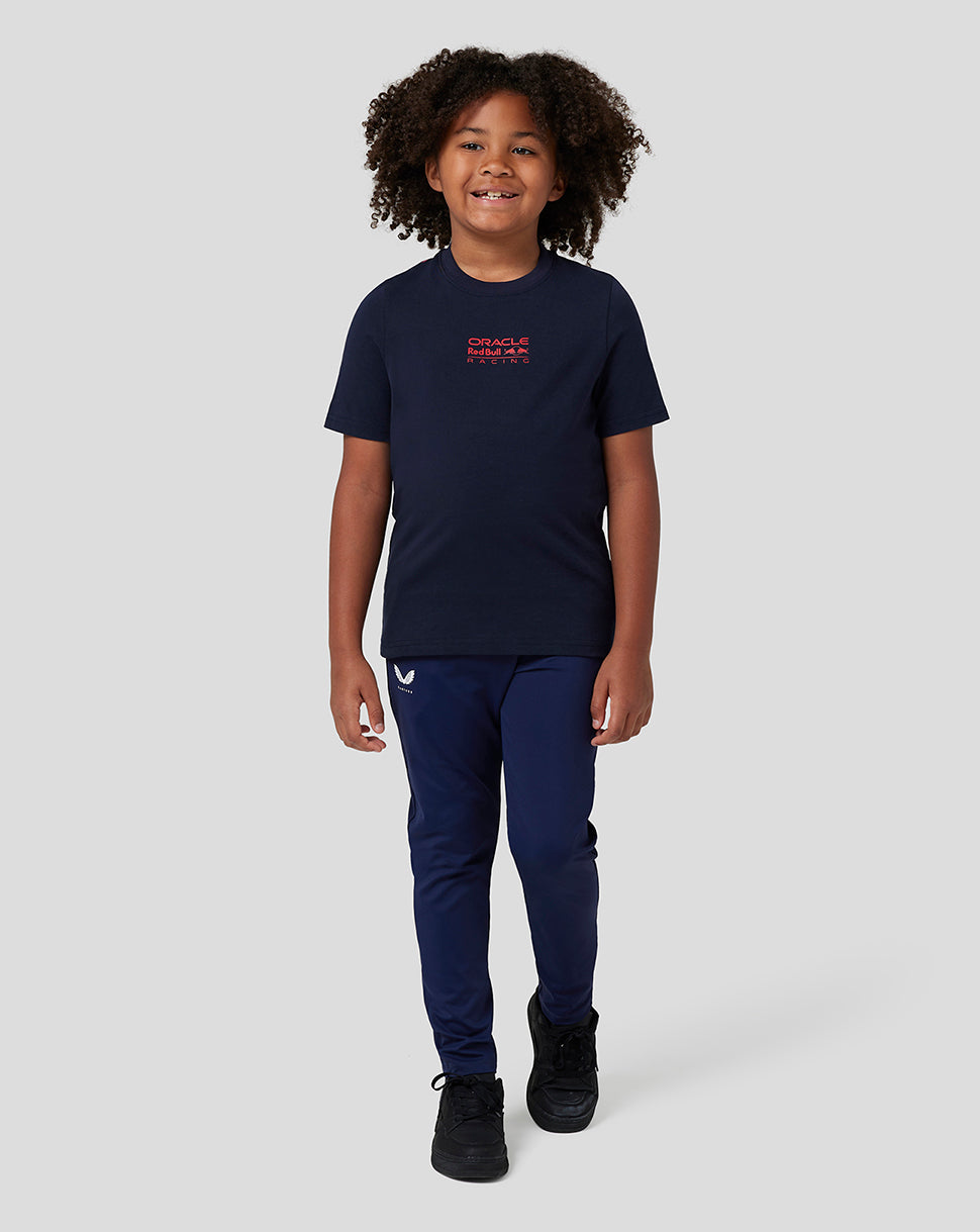 Child wearing navy Red Bull Racing graphic T shirt with logo on front and bull graphic on back