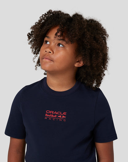 Young child wearing a navy Night Sky Oracle Red Bull Racing T-shirt with a red logo on the chest