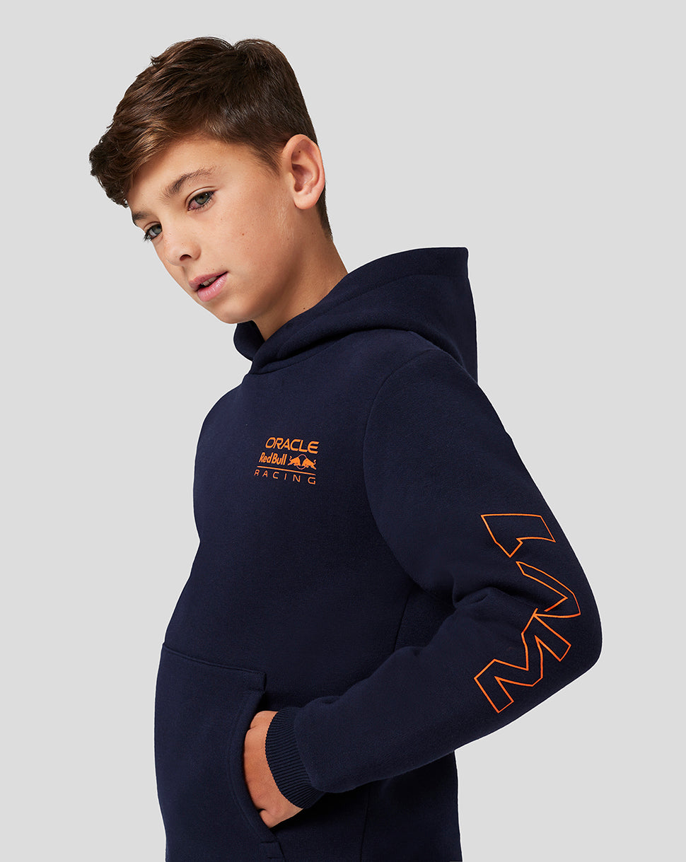 Close up of the navy hoodie sleeve displaying a bold orange graphic and the chest Oracle Red Bull Racing logo nearby