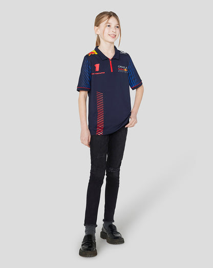 Front view of a girl in a navy Red Bull Racing polo featuring Verstappen name and number on the chest.