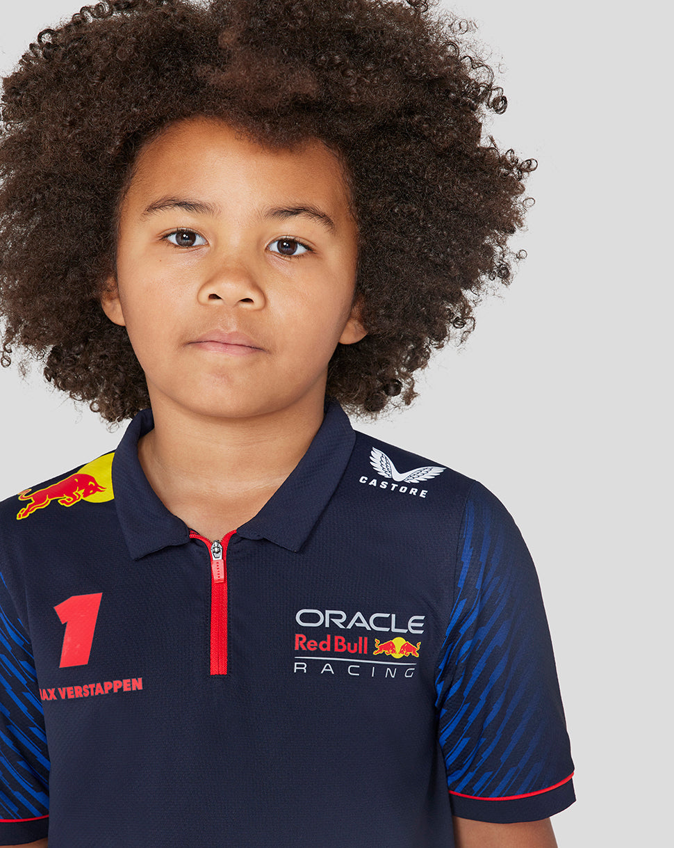 Child wearing a navy Oracle Red Bull Racing polo with red zipper and large number 1 on the chest