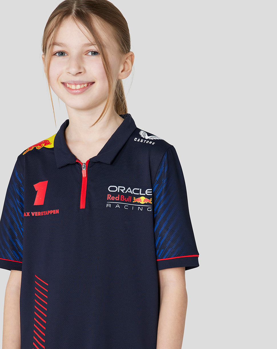 Girl wearing a navy Oracle Red Bull Racing polo with red zipper and racing sponsor logos on the chest
