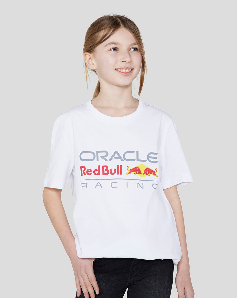 Young girl wearing white Oracle Red Bull Racing junior large front logo T shirt
