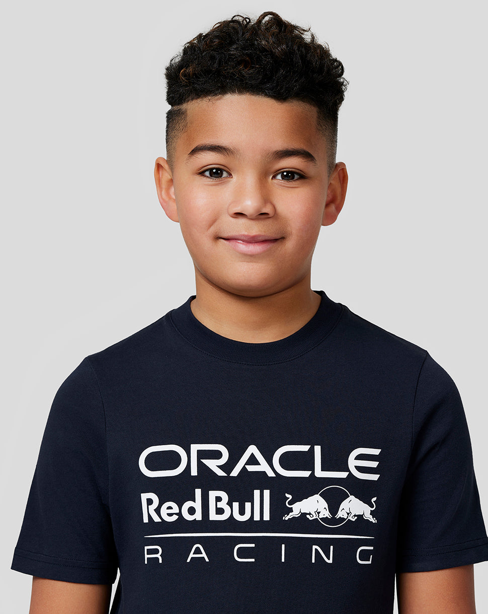 Young boy wearing a navy Oracle Red Bull Racing large front logo tee