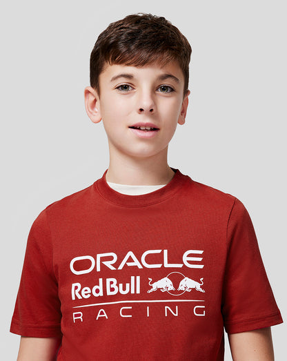 Front view of a child wearing a red Oracle Red Bull Racing juniors tee with a white logo on the chest