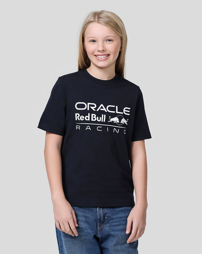 Girl with blonde hair wearing a navy Oracle Red Bull Racing large front logo tee