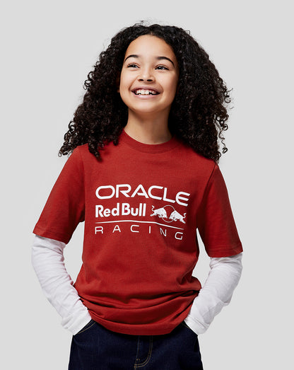 Young girl wearing red Oracle Red Bull Racing tee with white front logo