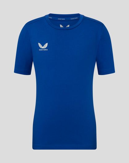 Front view of blue Junior Cotton Leisure Tee with Castore logo on the left chest and branding along the inside neck.