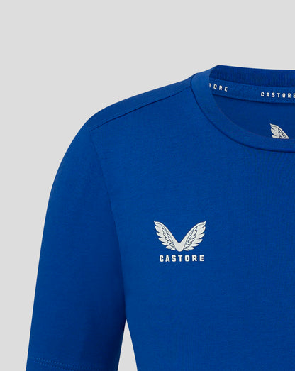 Blue junior cotton leisure tee close up showing self fabric crew neck and forward shoulder seam with Castore wing logo