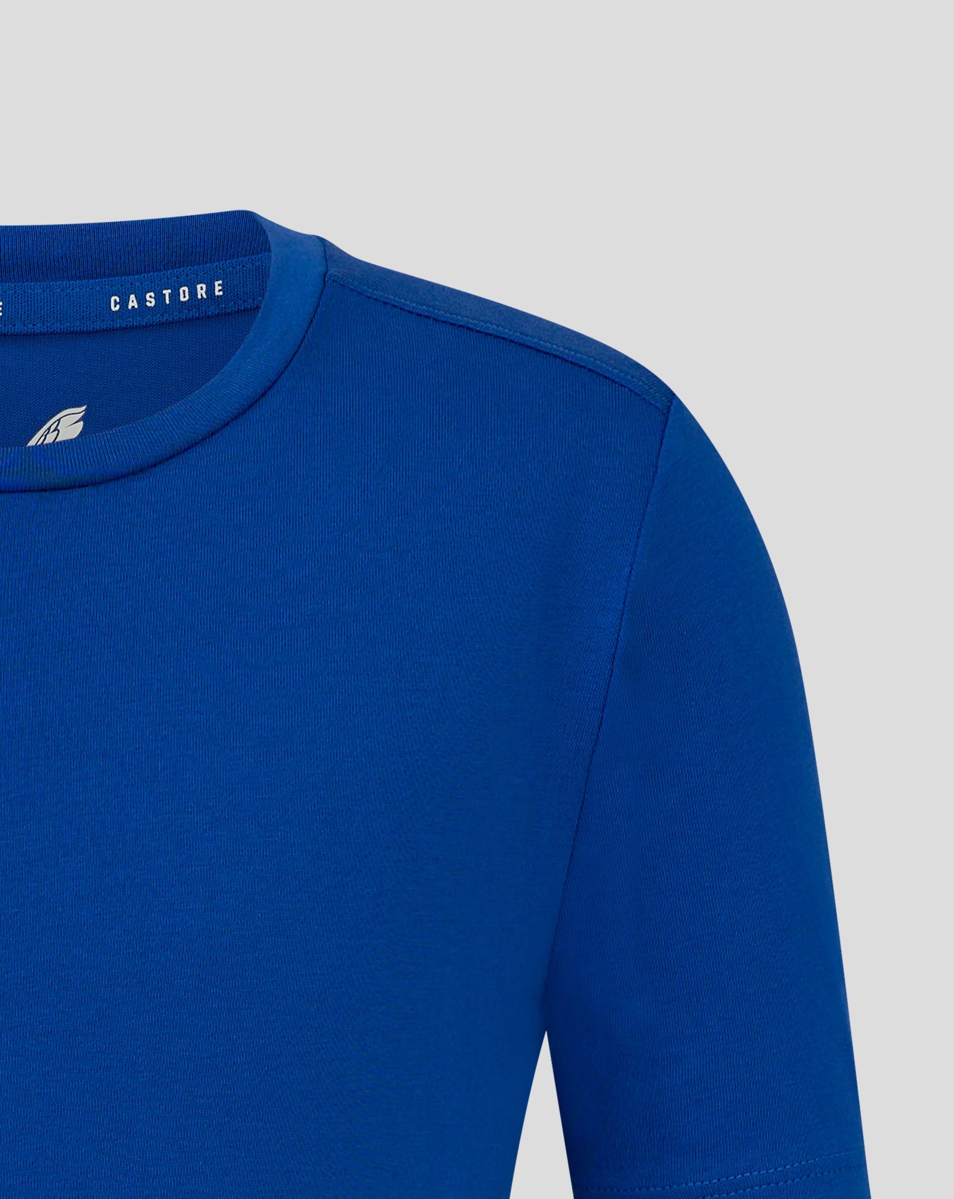 Blue junior cotton leisure tee neck area close up with collar detail and Castore branding on the neck trim