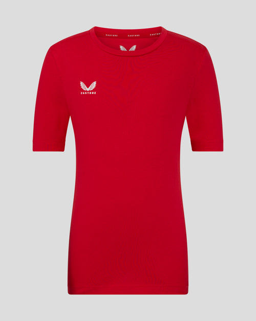 Front view of red Junior Cotton Leisure Tee with a white Castore logo on the left chest and crew neck.
