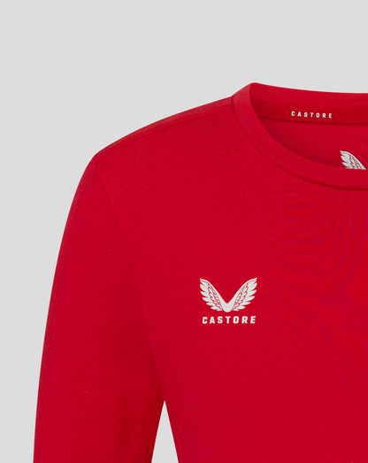 Front close-up of red tee showing a large white wing logo with Castore text.