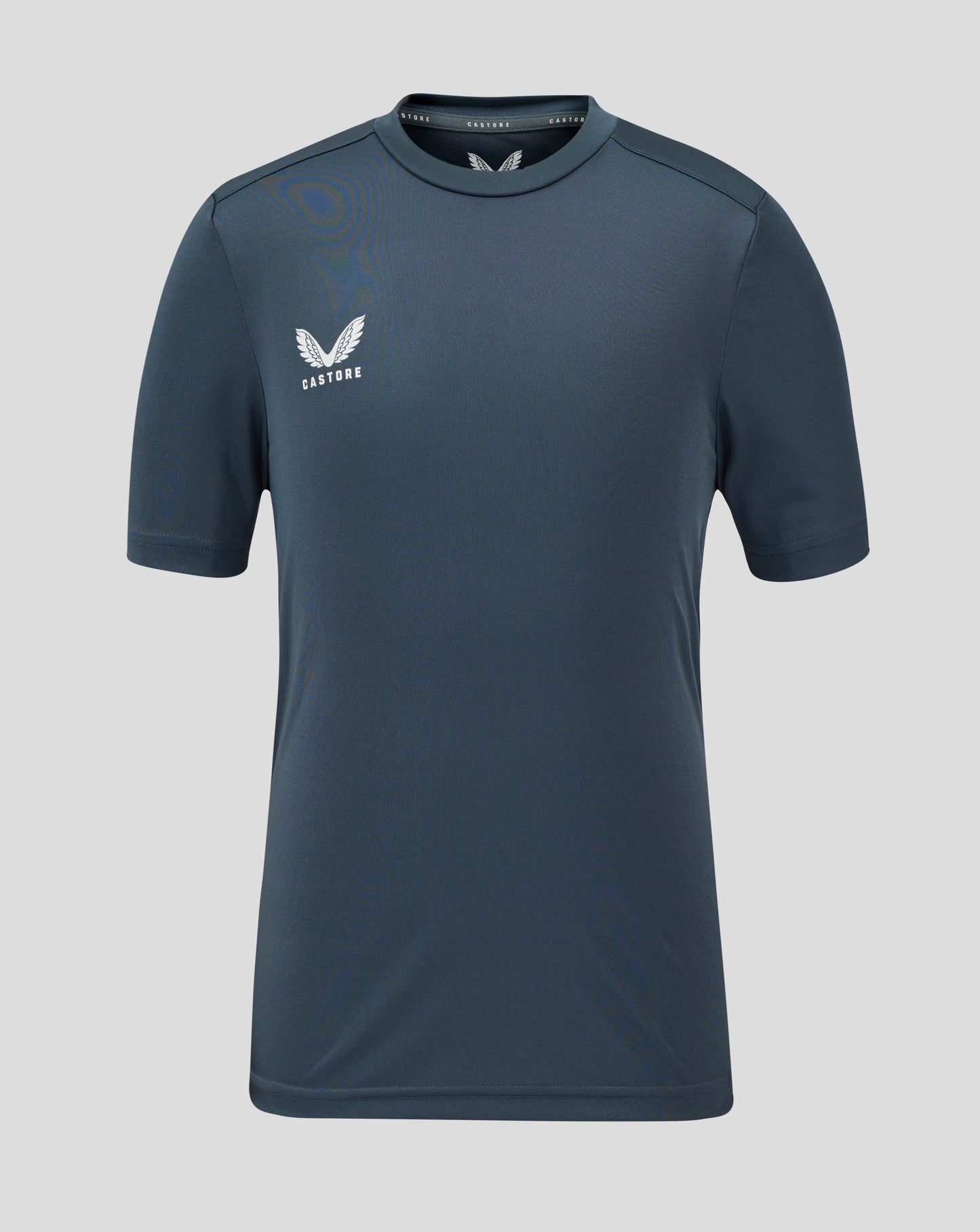 Front view of junior performance tee in dark slate with crew neck and Castore logo
