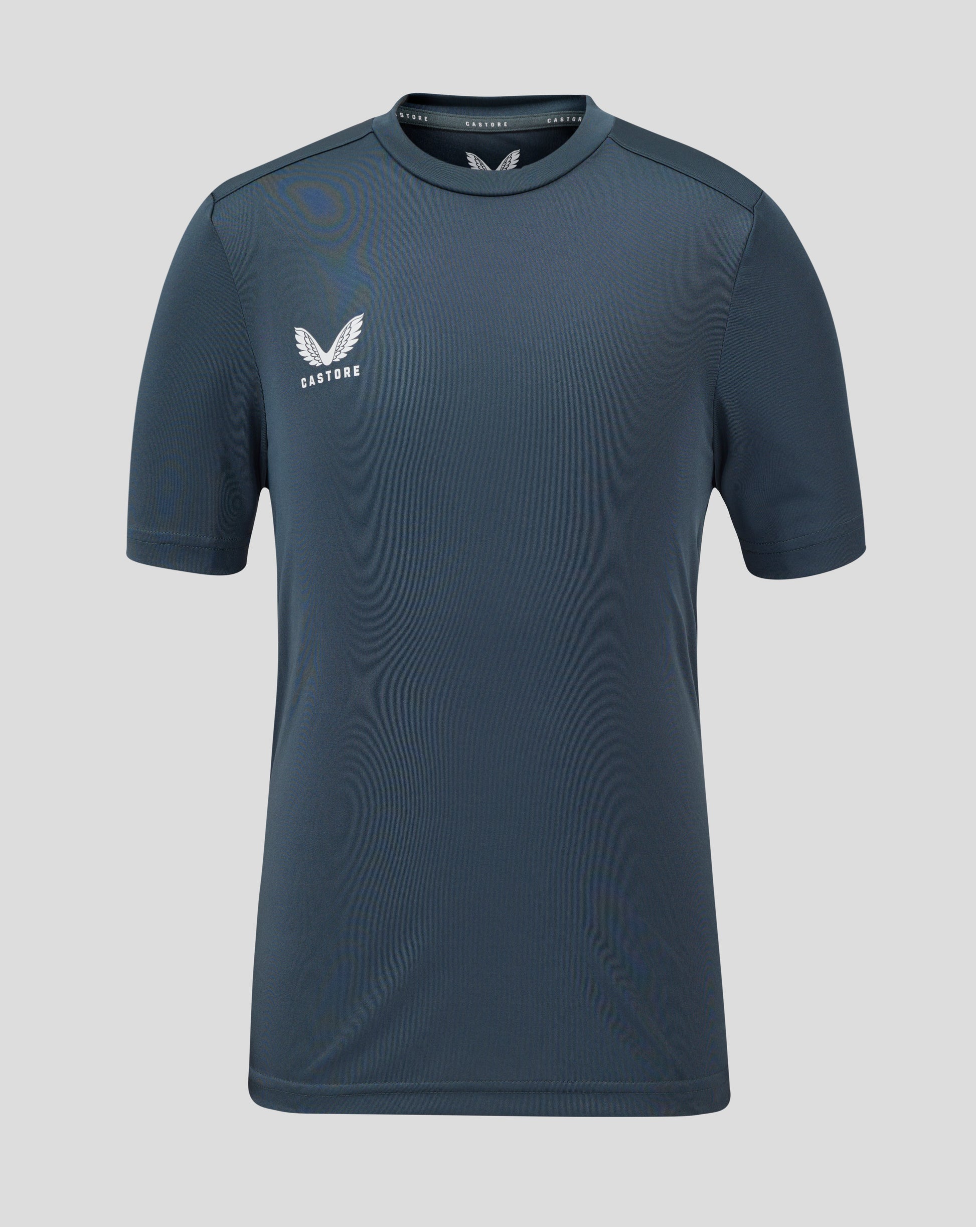 Front view of junior performance tee in dark slate with crew neck and Castore logo