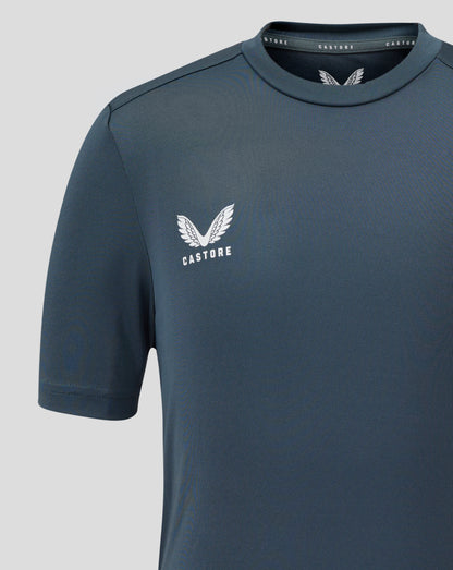 Dark slate junior performance tee with crew neck and short sleeves showing a white Castore wing logo on the chest.