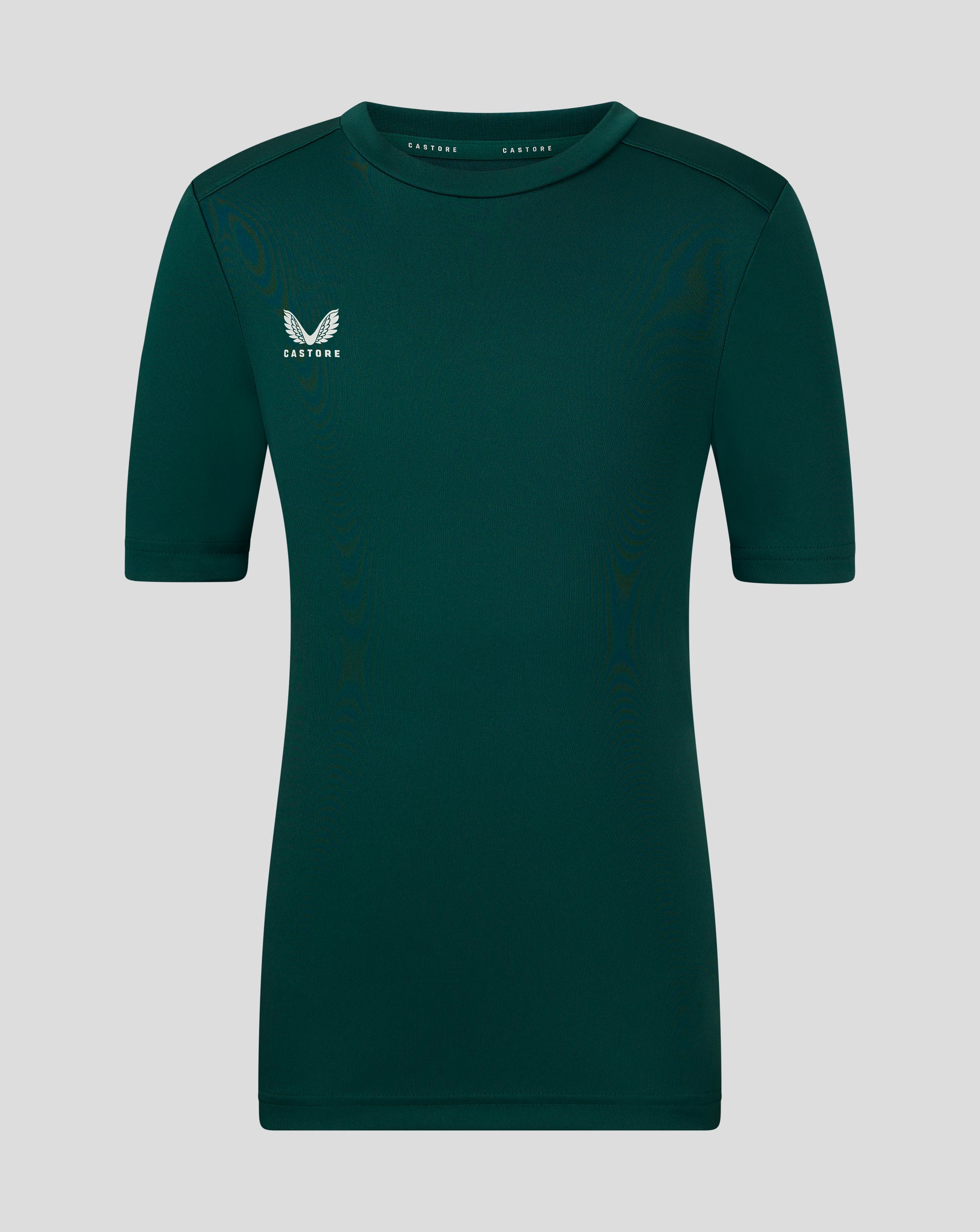 Junior performance tee in deep botanical green with white wing Castore logo on the left chest.
