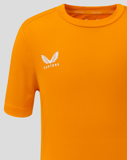 Close-up of white Castore logo on left chest of bright marigold crew neck tee