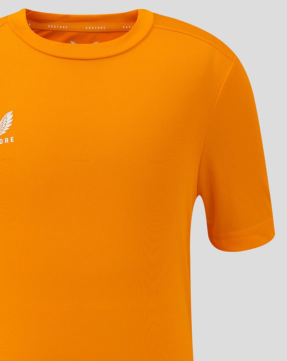 Bright marigold junior performance tee with crew neck and Castore logo on the chest