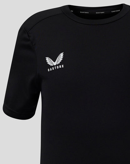 Close-up of black Junior Performance Tee with white Castore logo on left chest