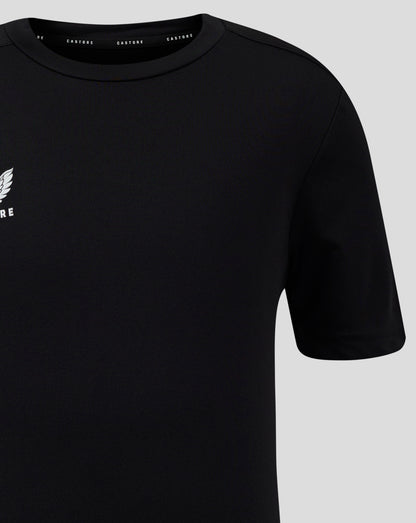 Close up of black Junior Performance Tee showing crew neck collar and partial white Castore logo on the left chest