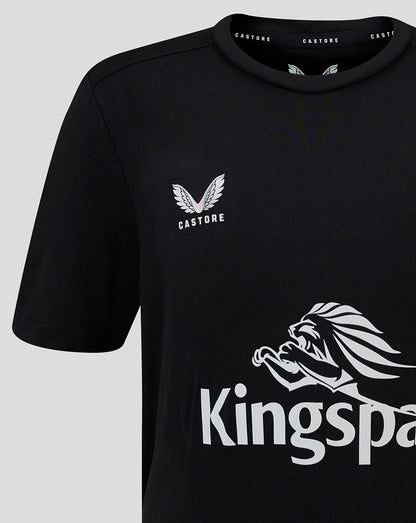 Close-up of black tee showing a small Castore logo on the left chest and a large Kingspan graphic across the front.