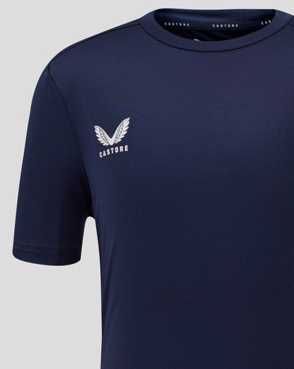 Close up of left chest with Castore logo on navy Junior Performance Tee.