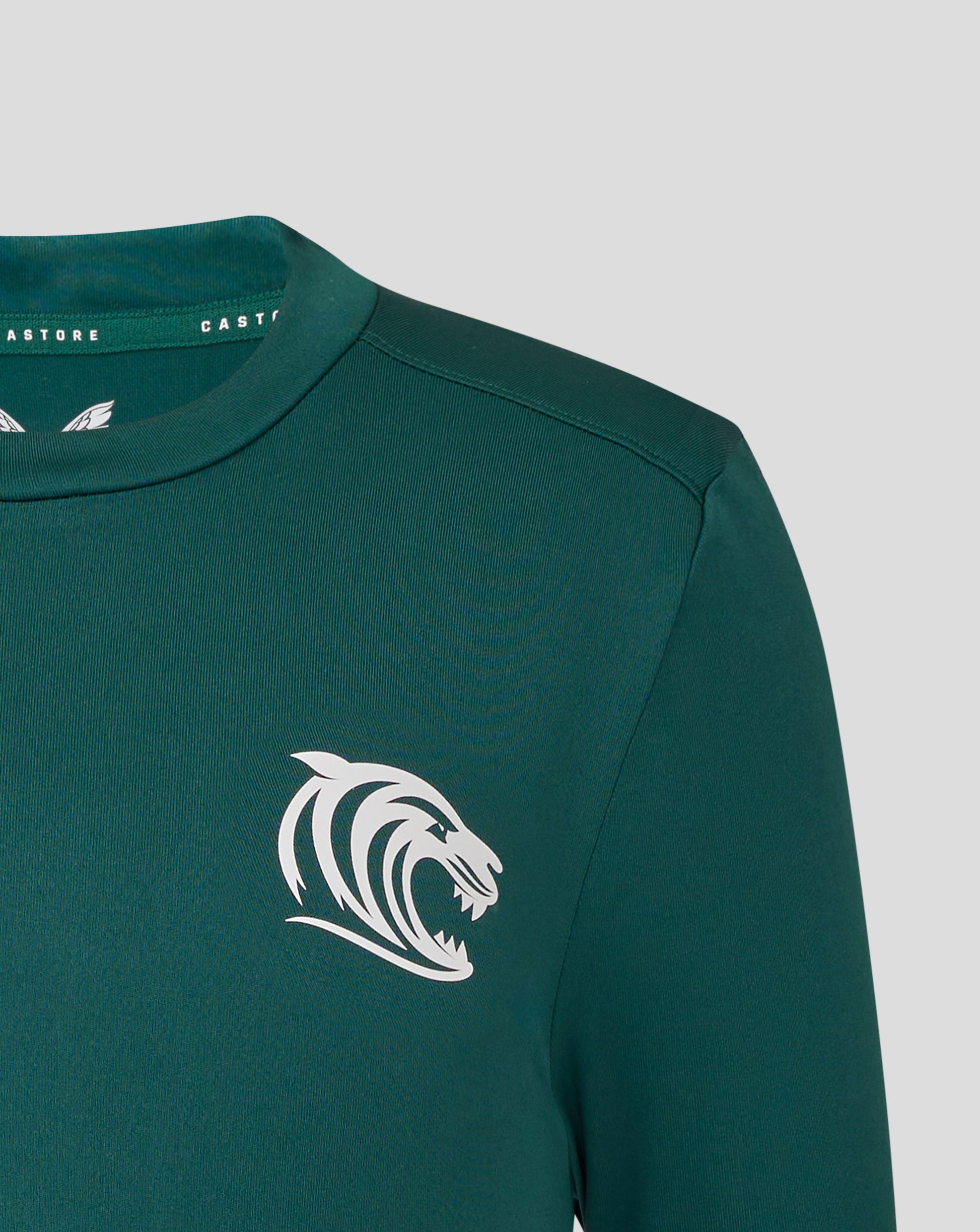 Close-up of neck and shoulder on green Botanical Leicester Tigers junior training T-shirt with Castore branding