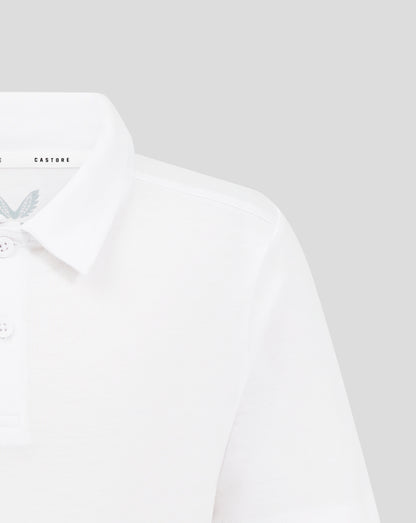 Close up of a white Junior Cotton Leisure Polo showing a collar three button placket and Castore logo on the inner collar