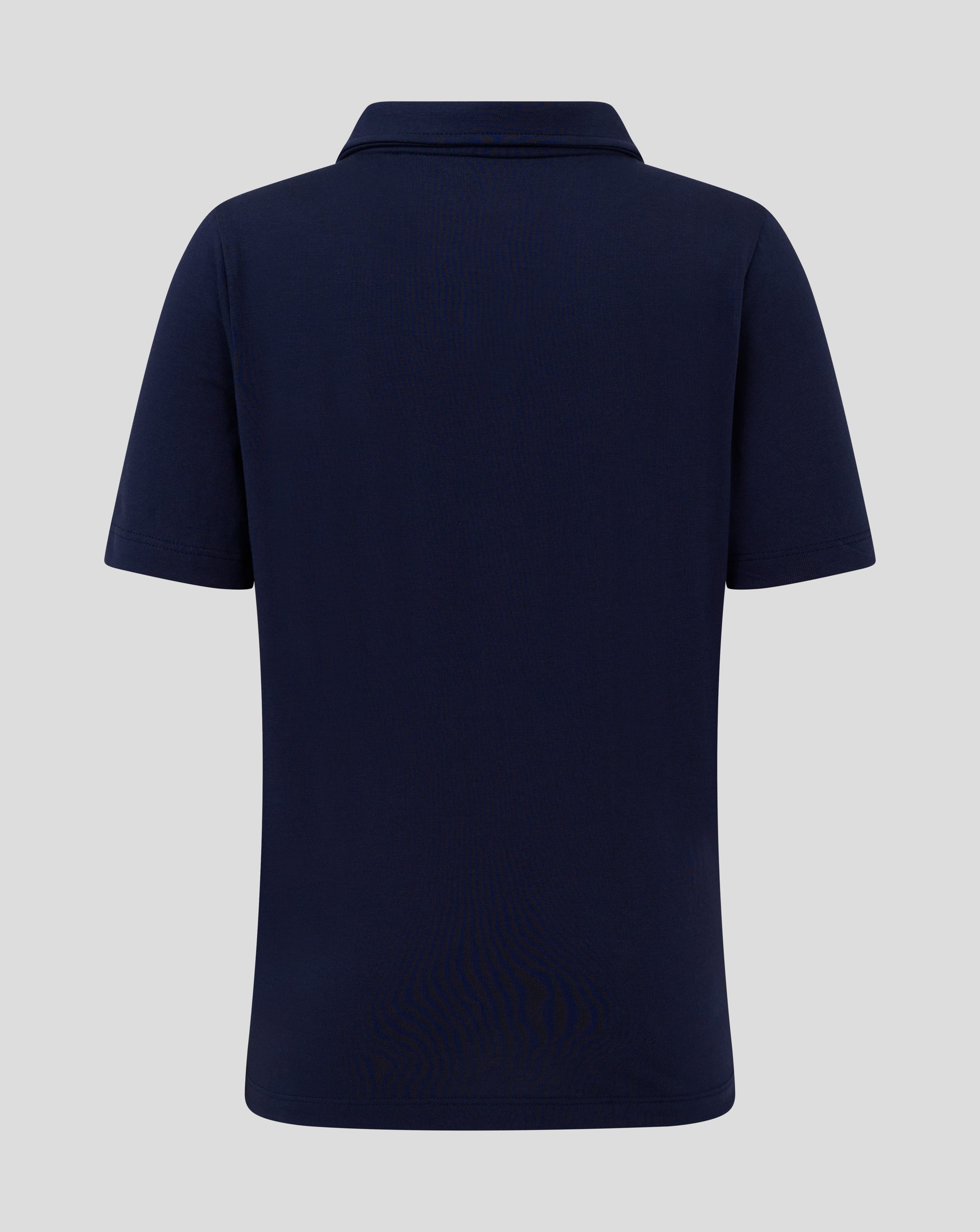 Back view of navy Junior Cotton Leisure Polo showing forward shoulder seam and clean silhouette