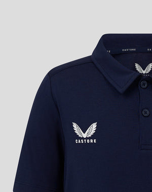 Navy junior polo with Castore logo on left chest and button placket at the collar