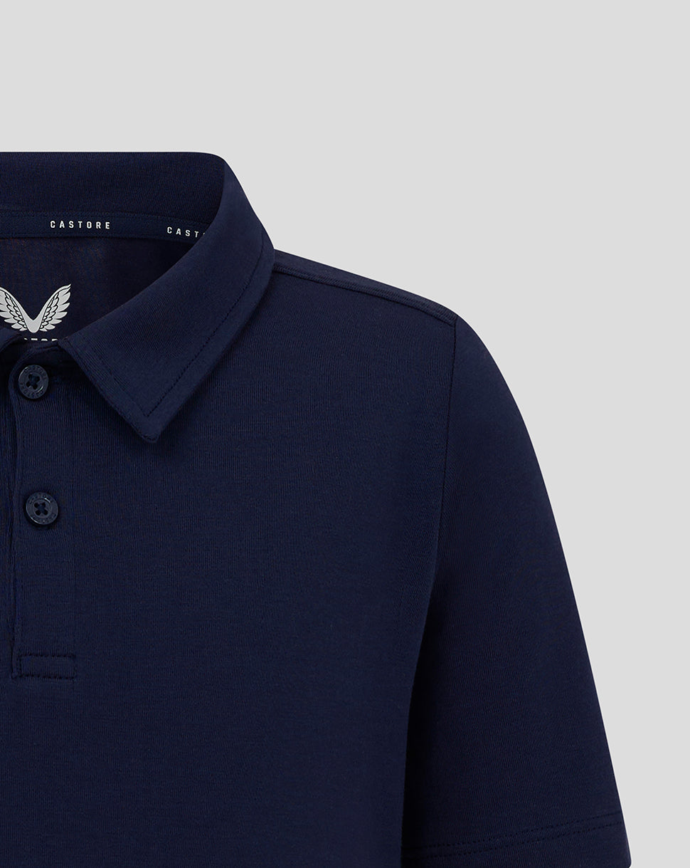 Navy Junior Cotton Leisure Polo with self fabric collar and three button placket featuring Castore branding