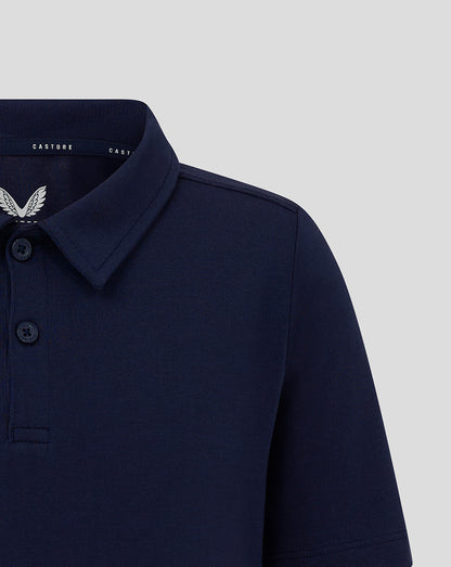 Navy Junior Cotton Leisure Polo with self fabric collar and three button placket featuring Castore branding