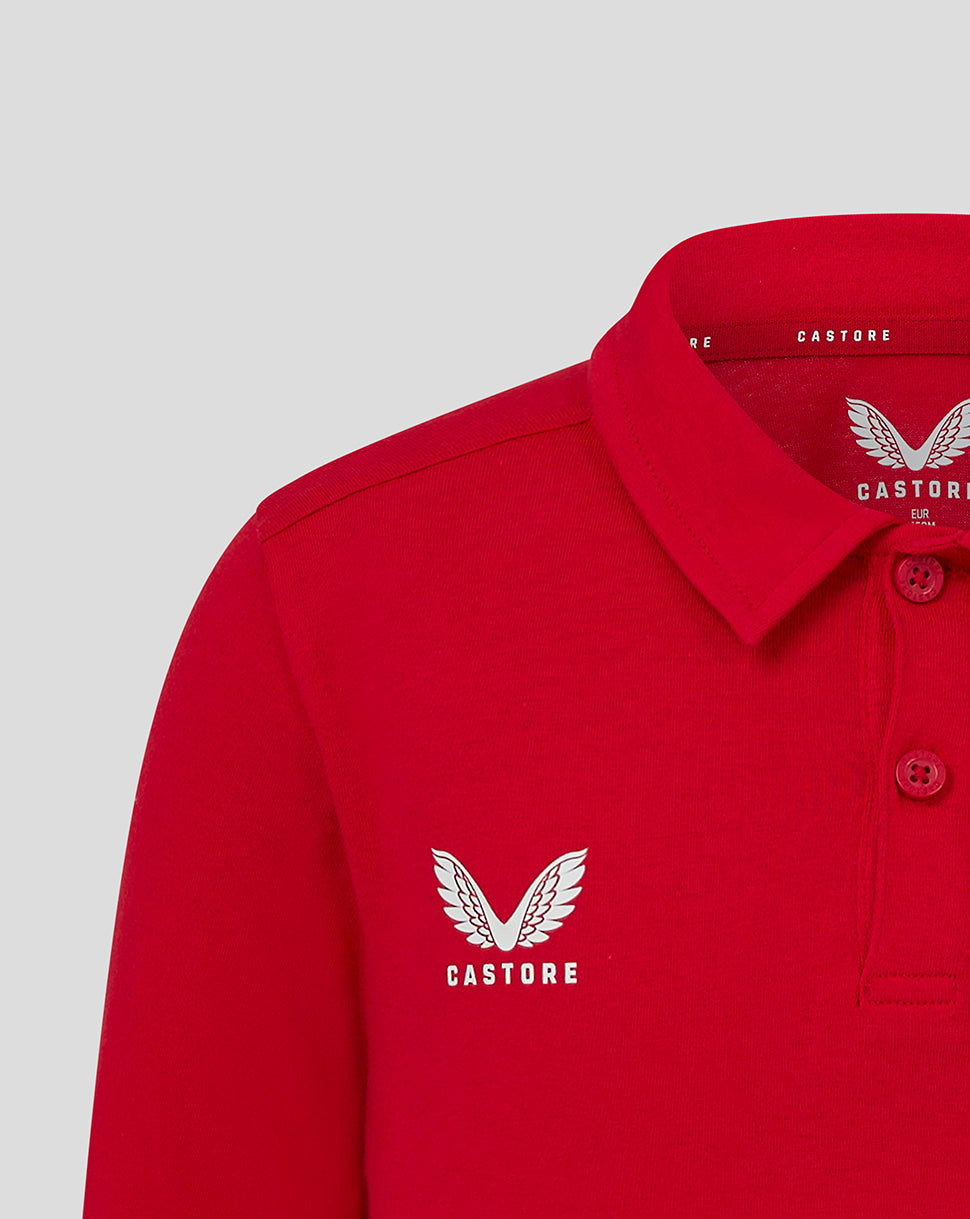 Close-up of red polo collar and left chest Castore logo with wing emblem