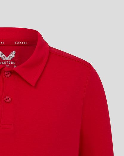 Close-up of red polo collar with two-button placket and shoulder seam detail