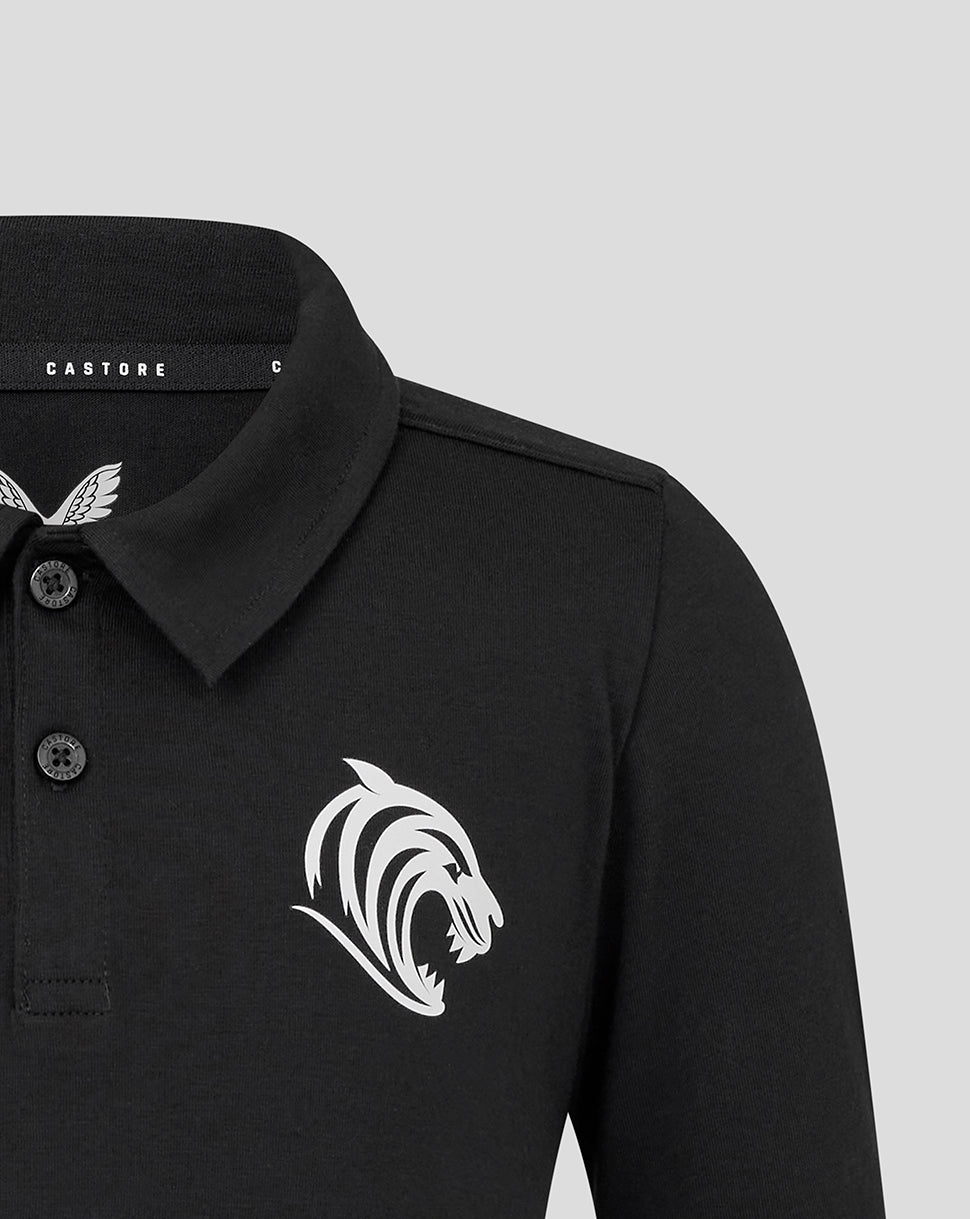 Close up of black Leicester Tigers training polo featuring a white tiger head crest on the chest and button placket.