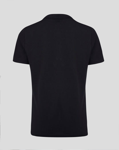 Back view of black Junior Cotton Leisure Polo showing self fabric collar forward shoulder seam and heat sealed Castore logo at the neck
