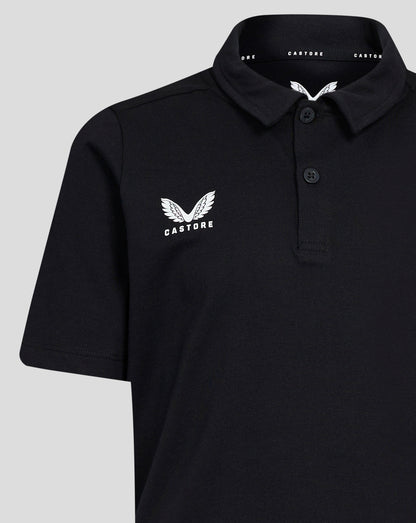 Front view of black Junior Cotton Leisure Polo with self fabric collar three button placket and Castore wing logo on left chest