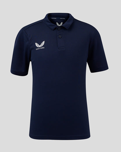 Front view of navy junior performance polo with three button placket and Castore logo on chest