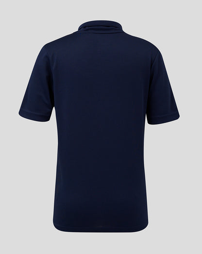 Back view of navy junior performance polo showing collar and short sleeves