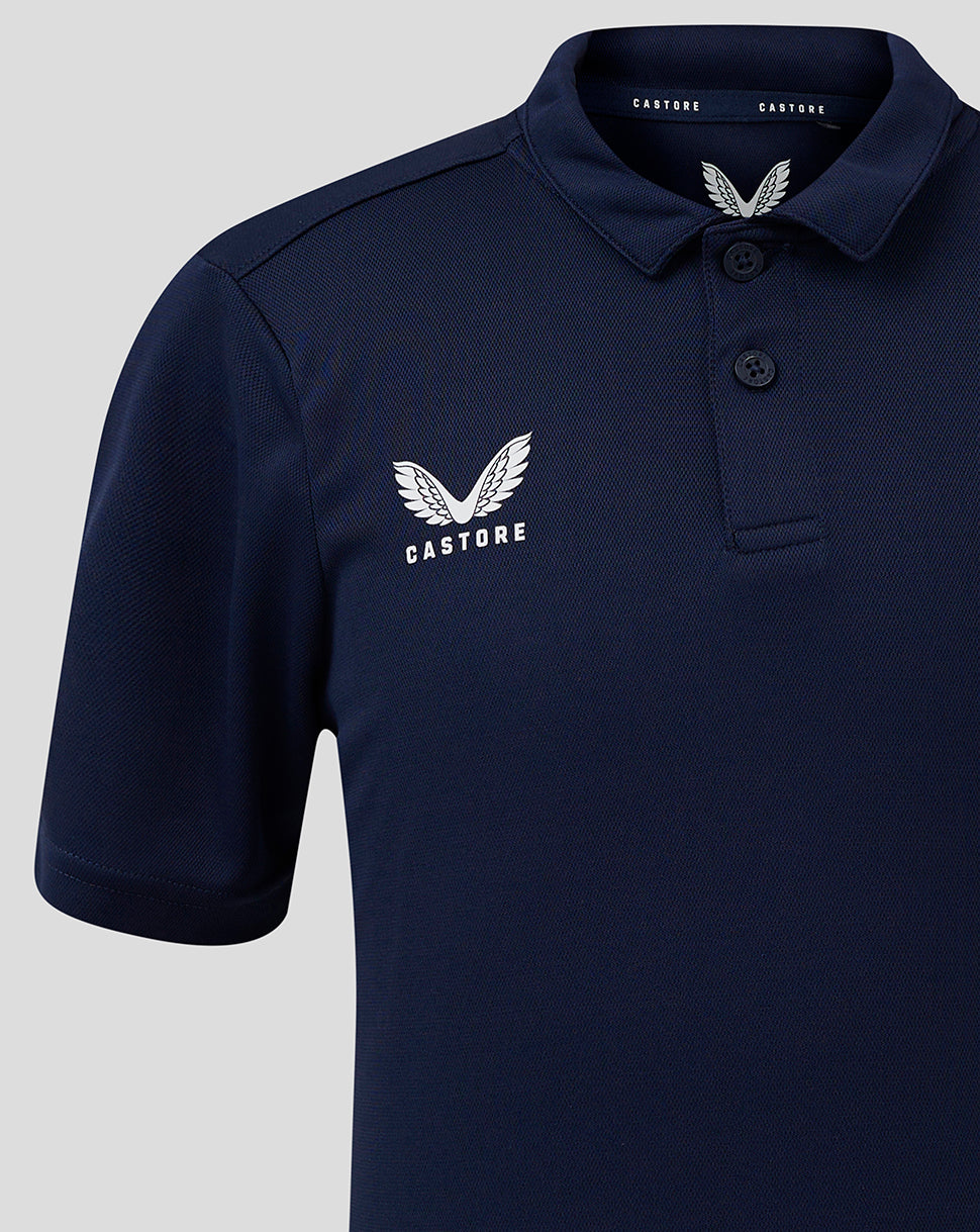 Junior Performance Polo in peacoat navy with white Castore wing logo on chest and three button placket