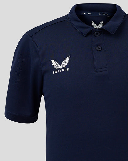 Junior Performance Polo in peacoat navy with white Castore wing logo on chest and three button placket