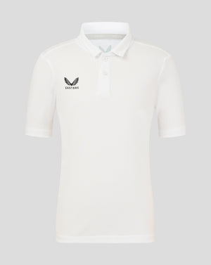 Front view of Brilliant White Junior Performance Polo with three-button placket and left chest wing logo