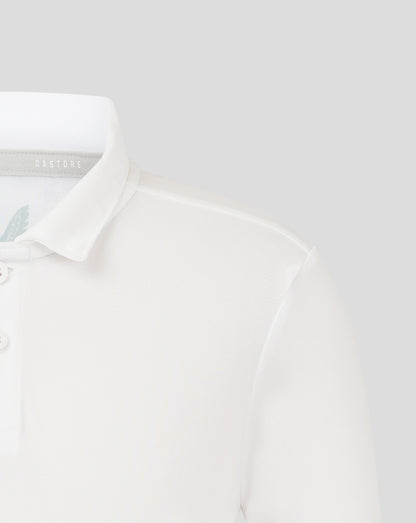Close up of white junior polo collar with Castore label inside and partial wing logo on chest